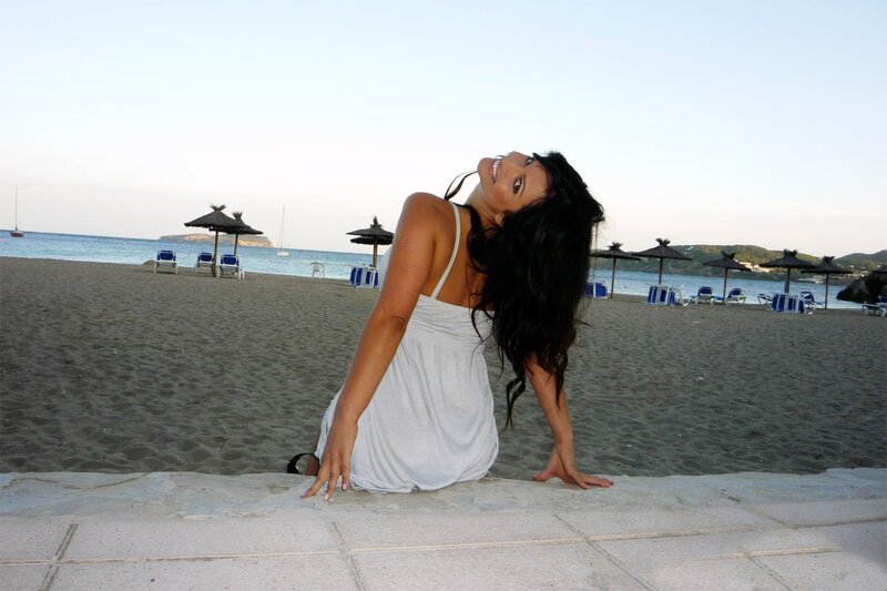 Woman on beach at sunset