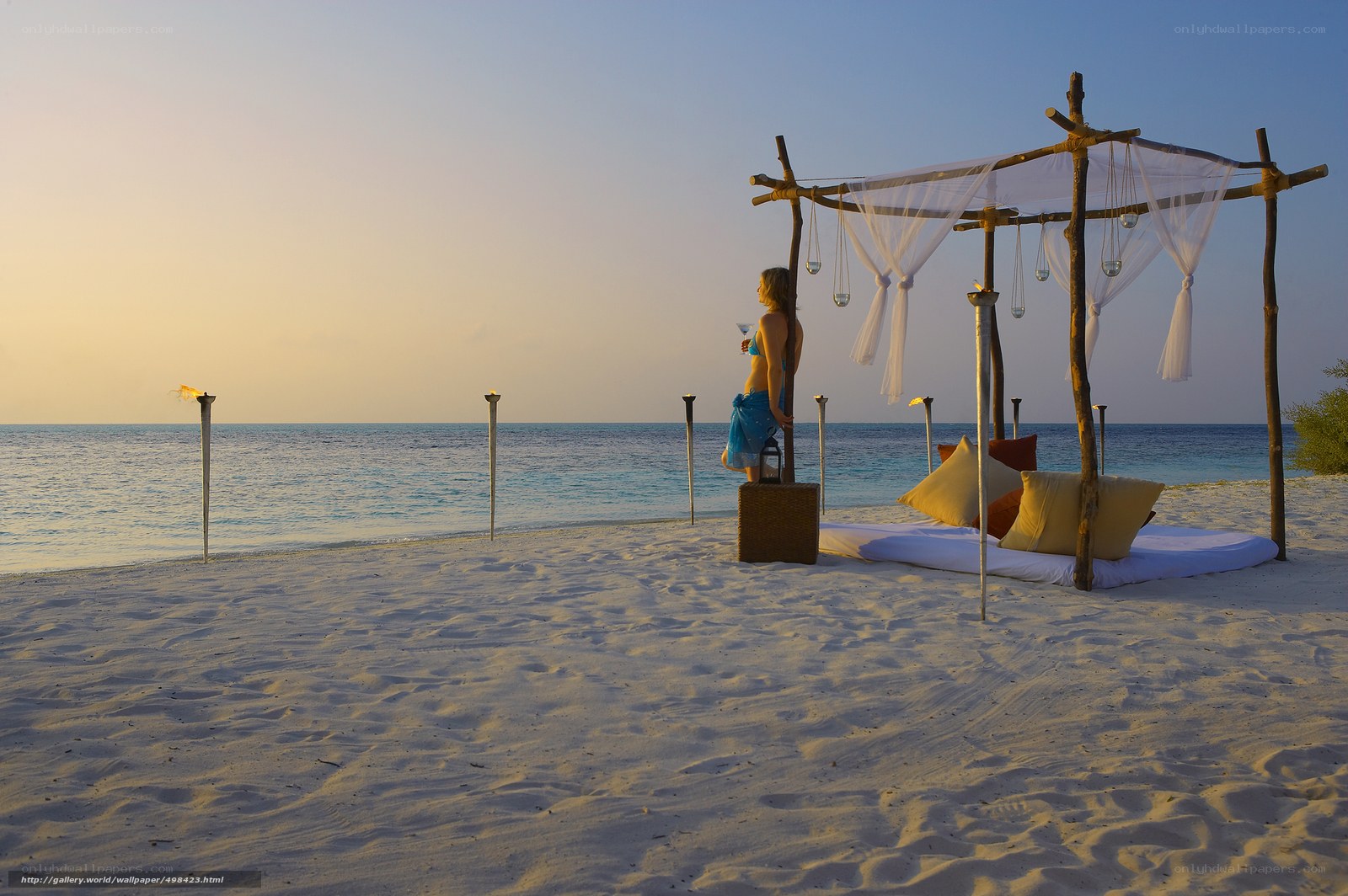 Woman on beach at sunset