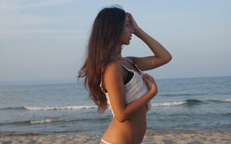 woman on beach at sunset