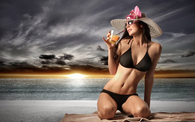 Woman on beach at sunset