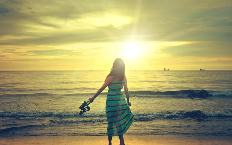 Woman on Beach at Sunset — Yellow, Serene, Photograph, Ocean, Sun