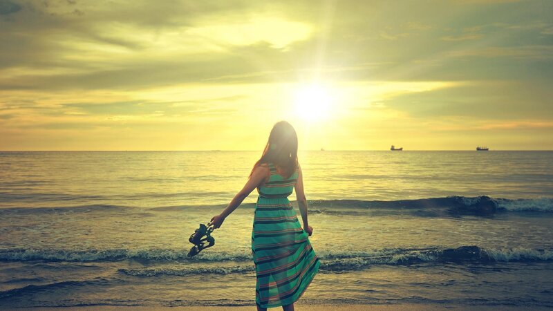 Woman on Beach at Sunset — Yellow, Serene, Photograph