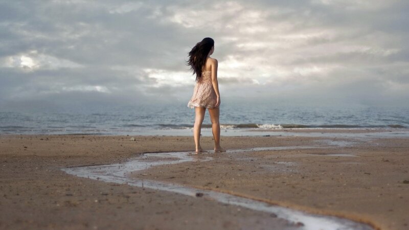Woman on Beach — Gray, Serene, Sunset