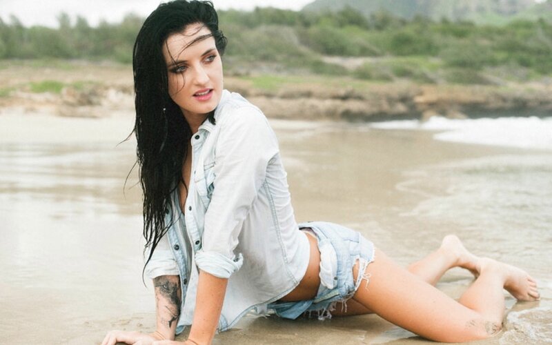 woman on beach in denim
