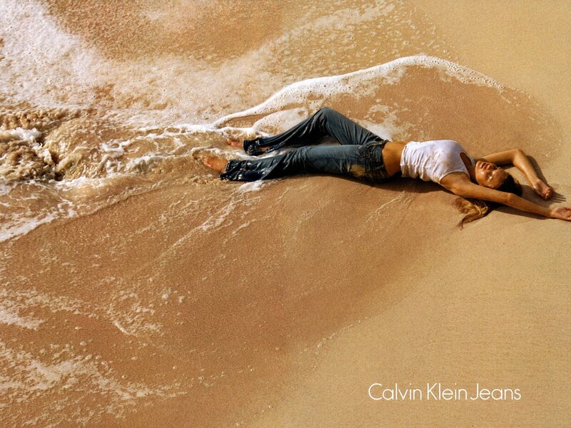 Woman on beach in jeans