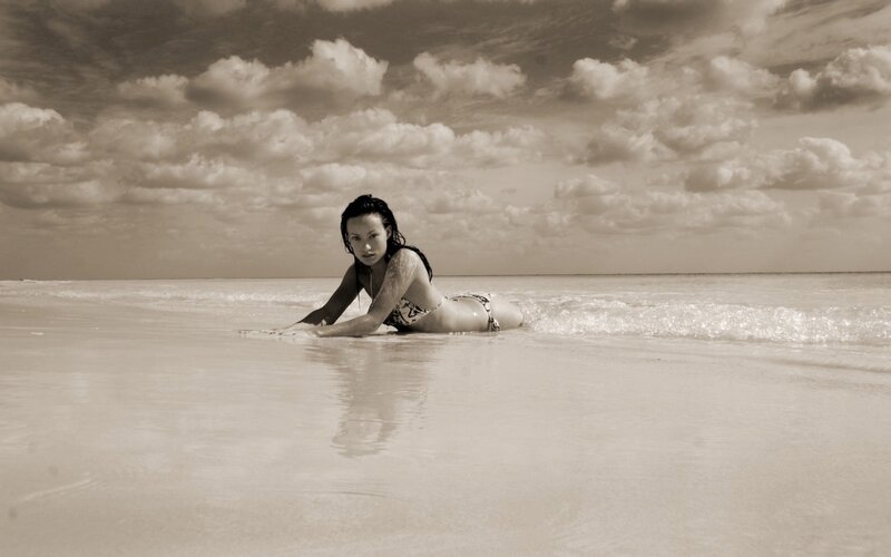 Woman on beach in sepia