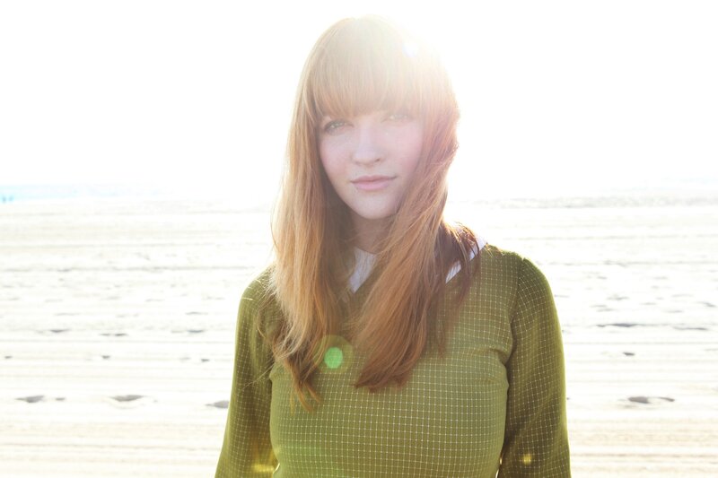 woman on beach in sunlight