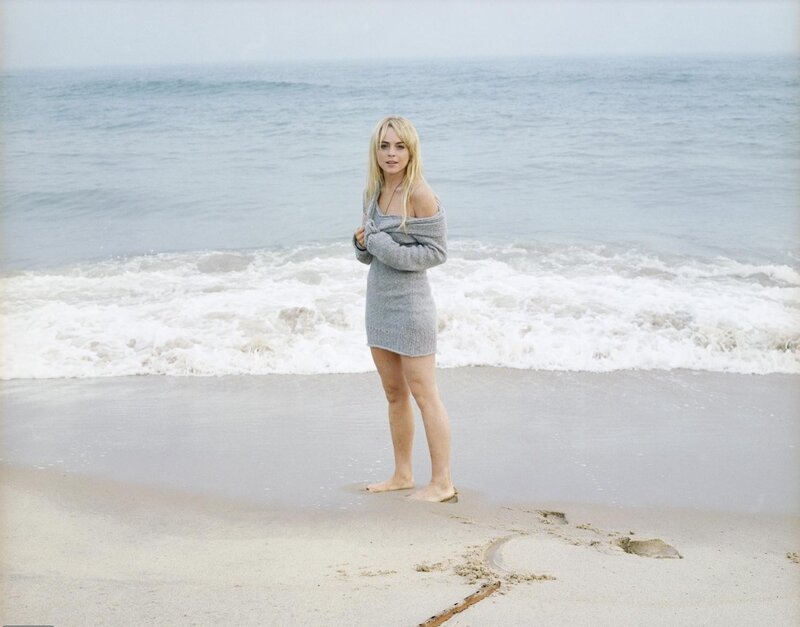 Woman on beach in sweater