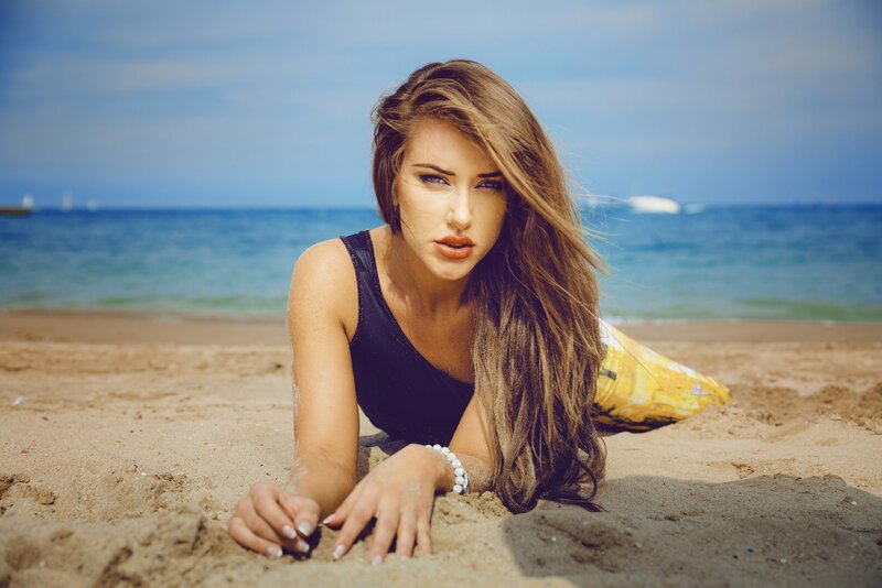 woman on beach in swimsuit