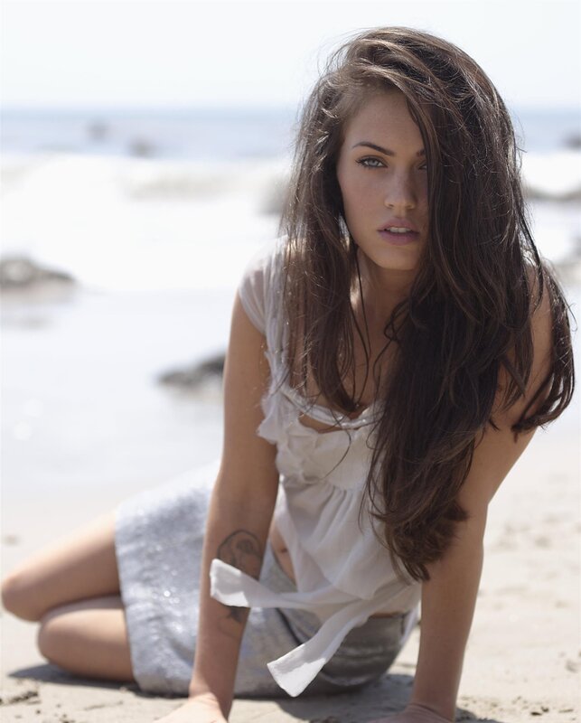 woman on beach in white top