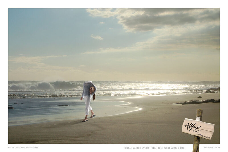 Woman on beach near sign
