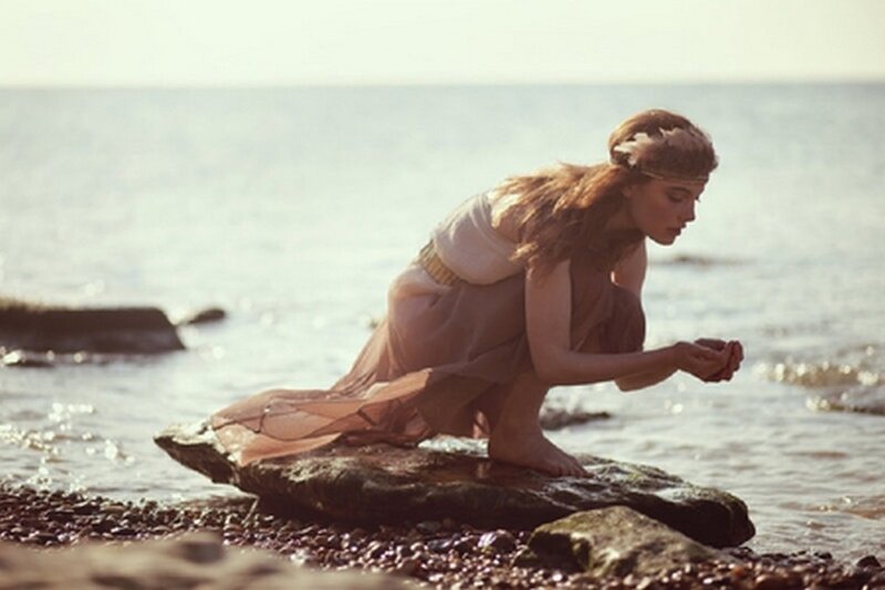 Woman on Beach Rock — Brown, Serene