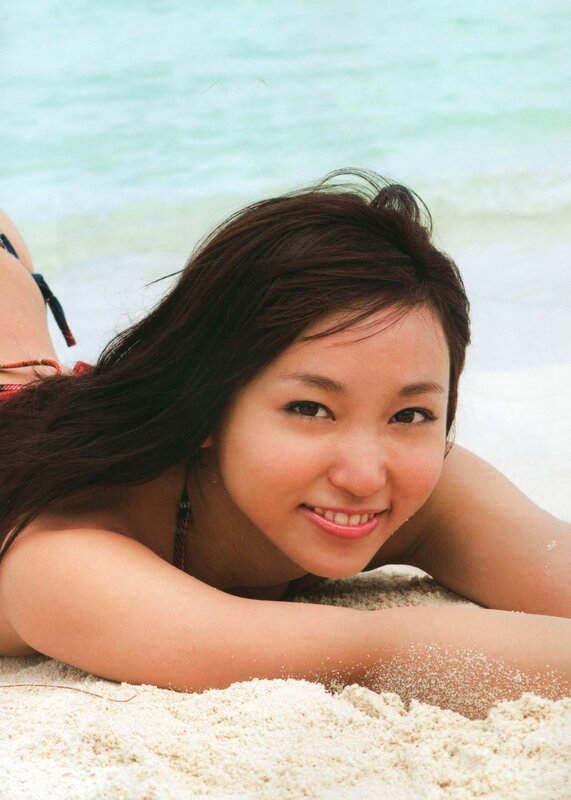 Woman on beach smiling
