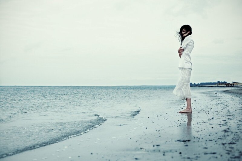 Woman on Beach — White, Melancholic