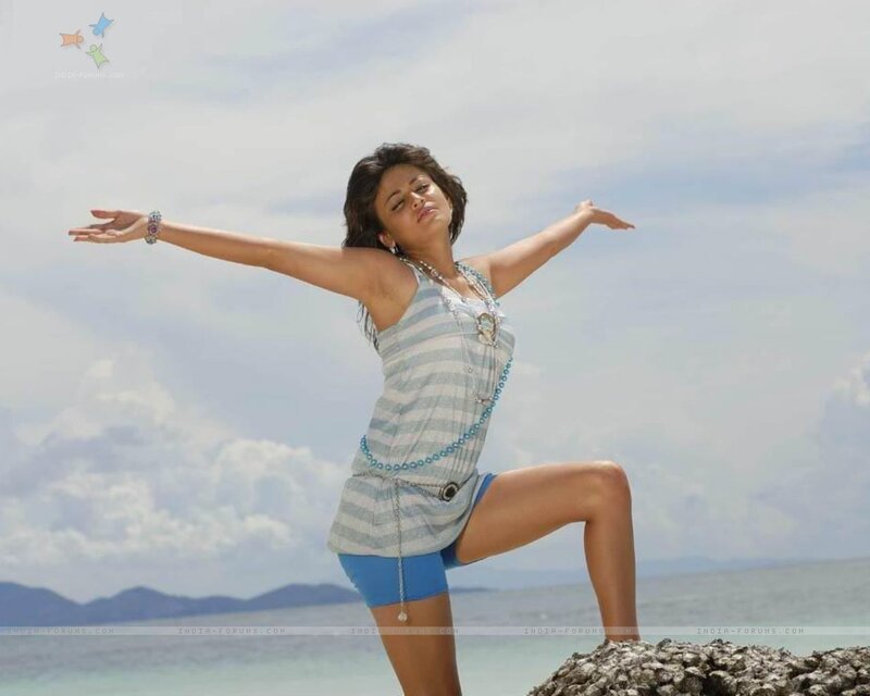 woman on beach with arms outstretched