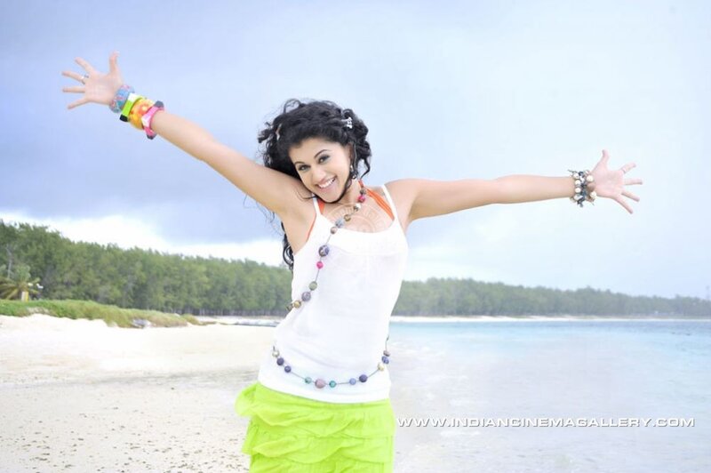 woman on beach with arms outstretched