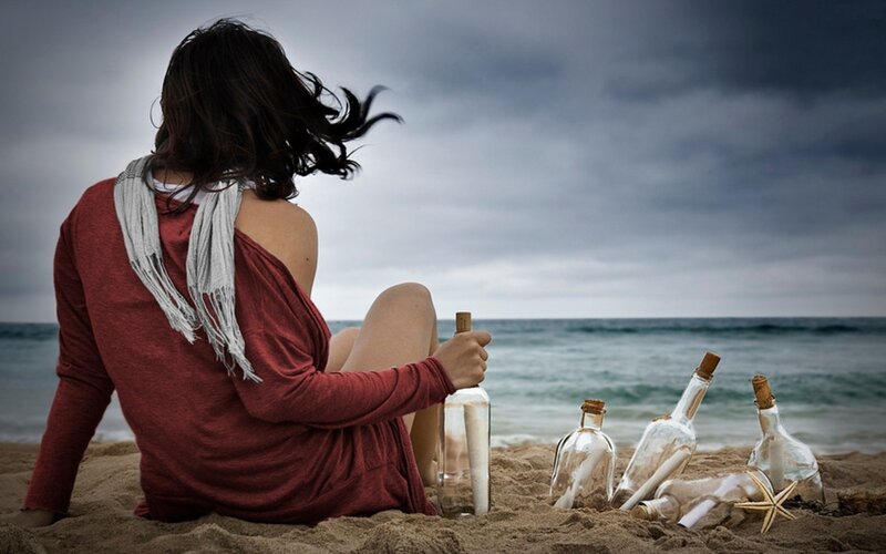 Woman on Beach with Bottles — Red