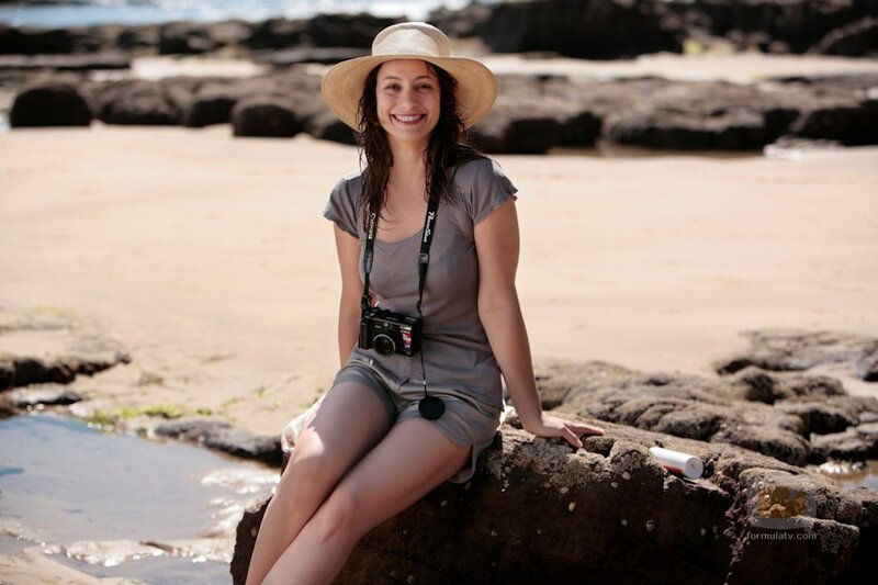 Woman on beach with camera