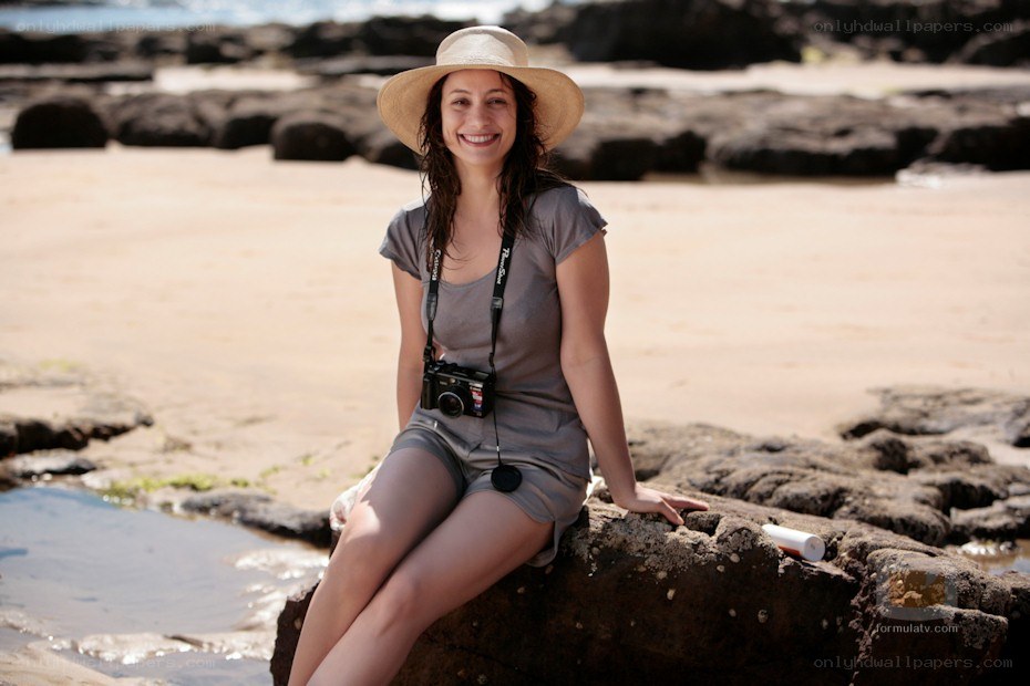 Woman on beach with camera