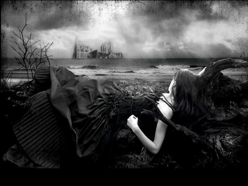 woman on beach with castle in distance