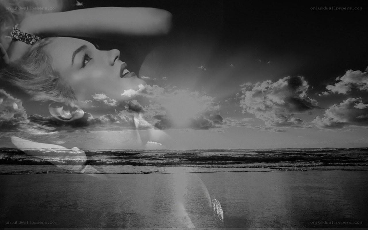 woman on beach with clouds