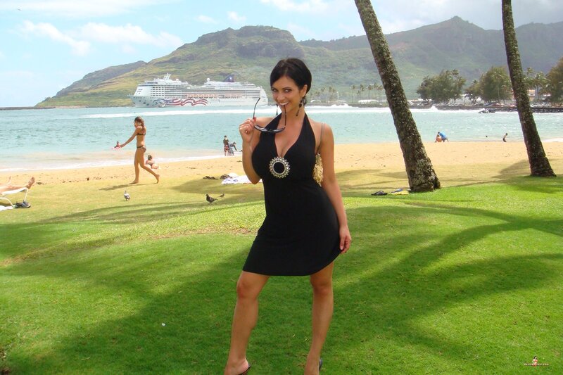 Woman on beach with cruise ship