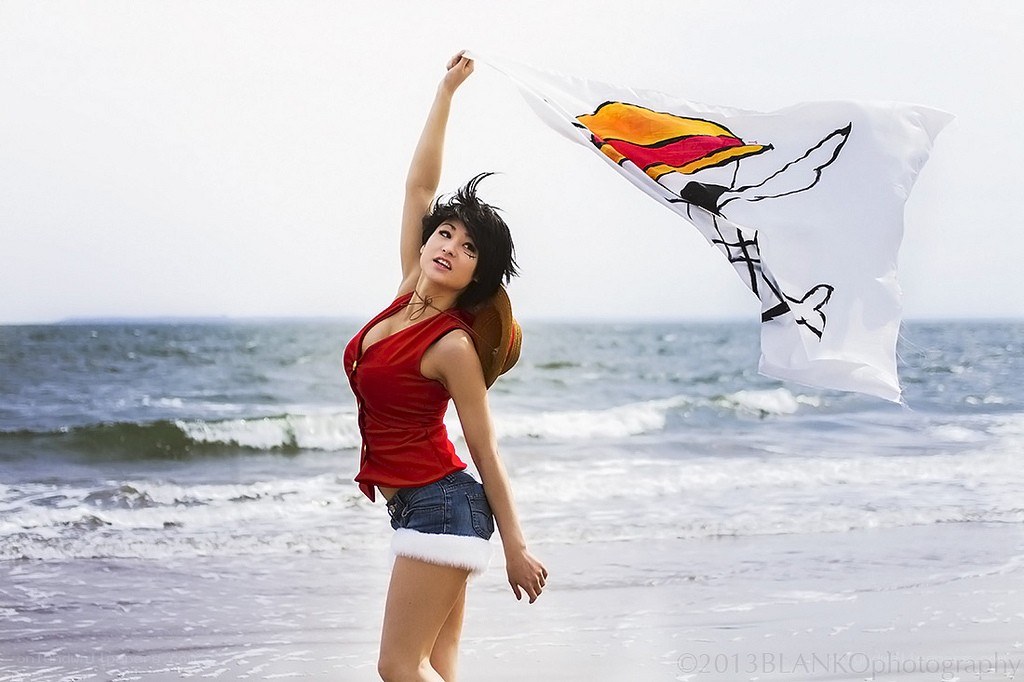 Woman on beach with flag