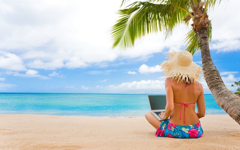 Woman on Beach with Laptop — Blue