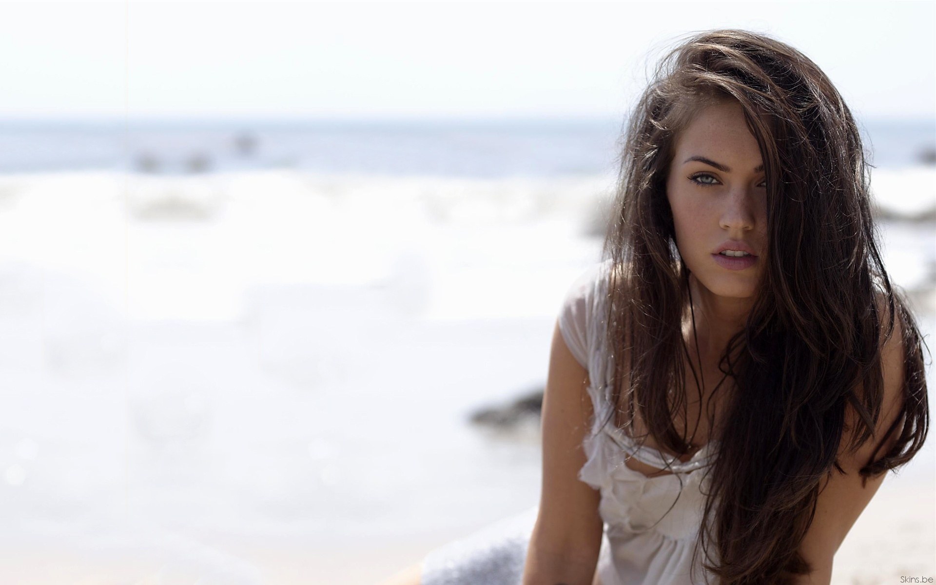 woman on beach with ocean
