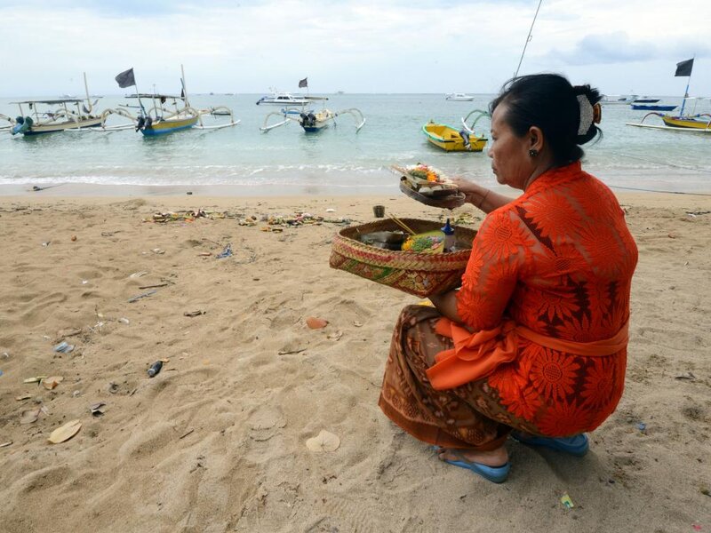 Woman on Beach with Offering