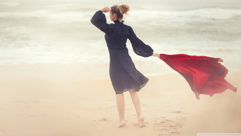 Woman on Beach with Red Cloth