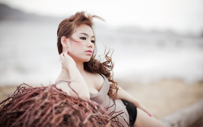 woman on beach with seaweed