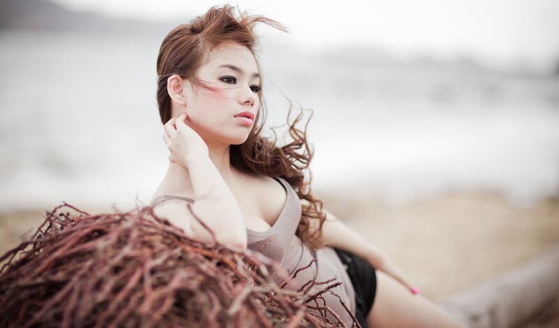 woman on beach with seaweed