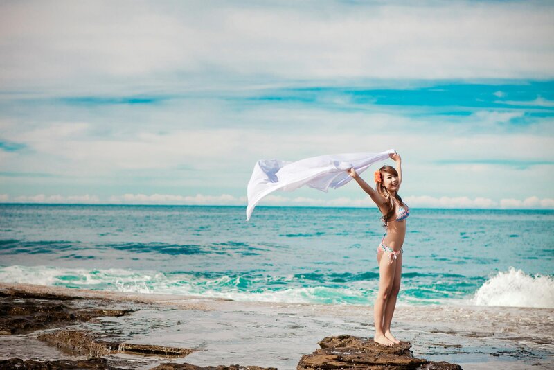 Woman on beach with towel