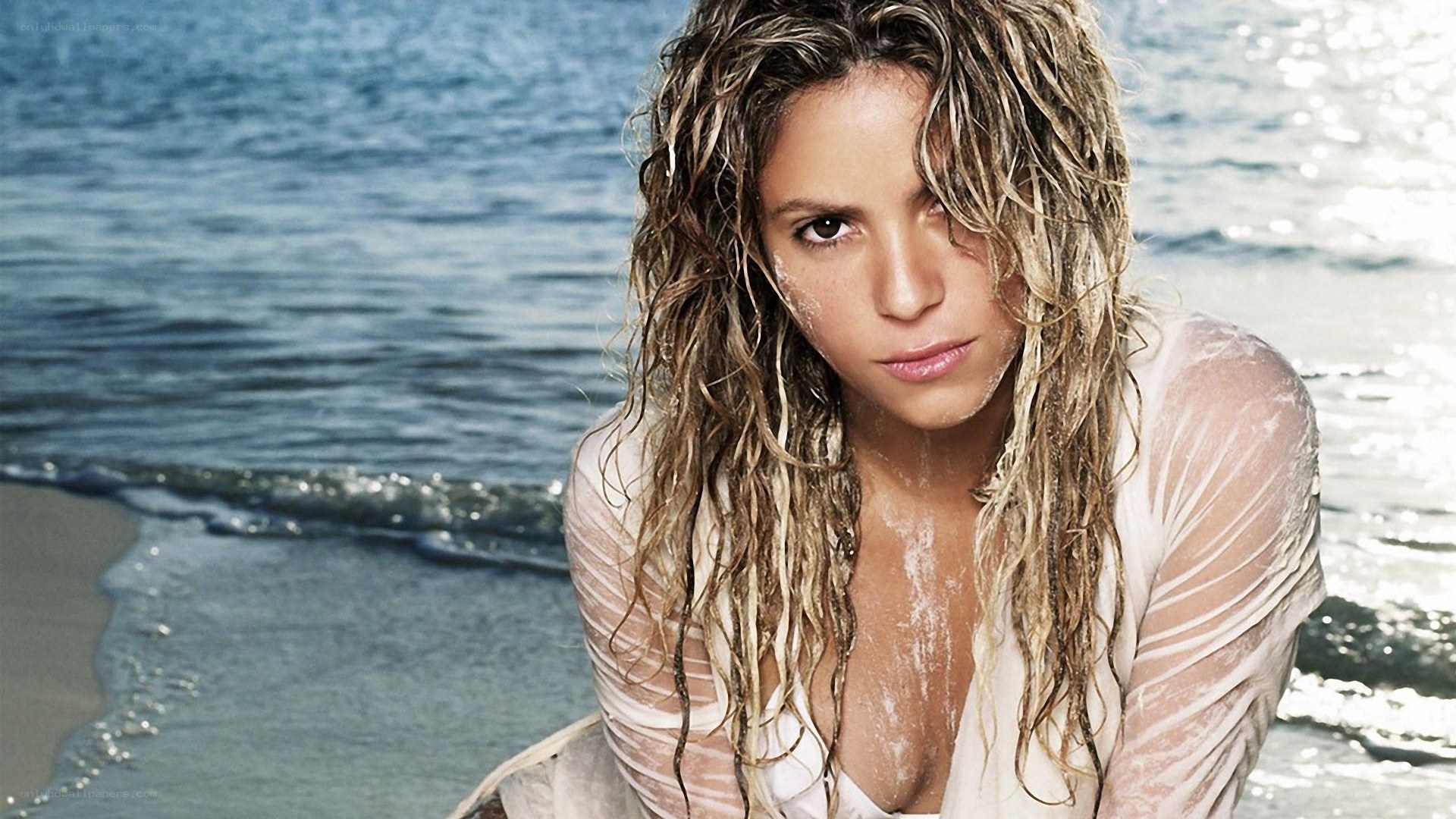 woman on beach with wet hair