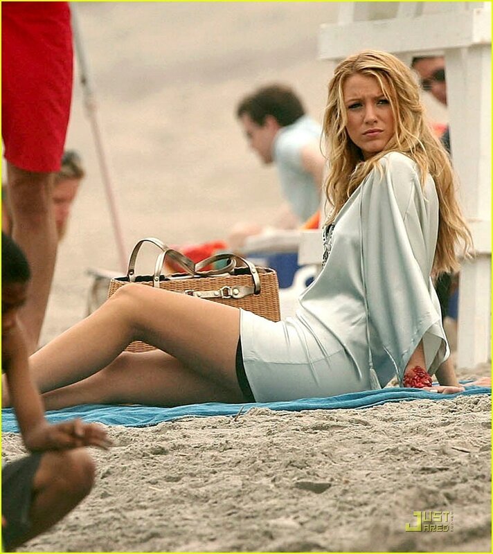 woman on beach with wicker bag
