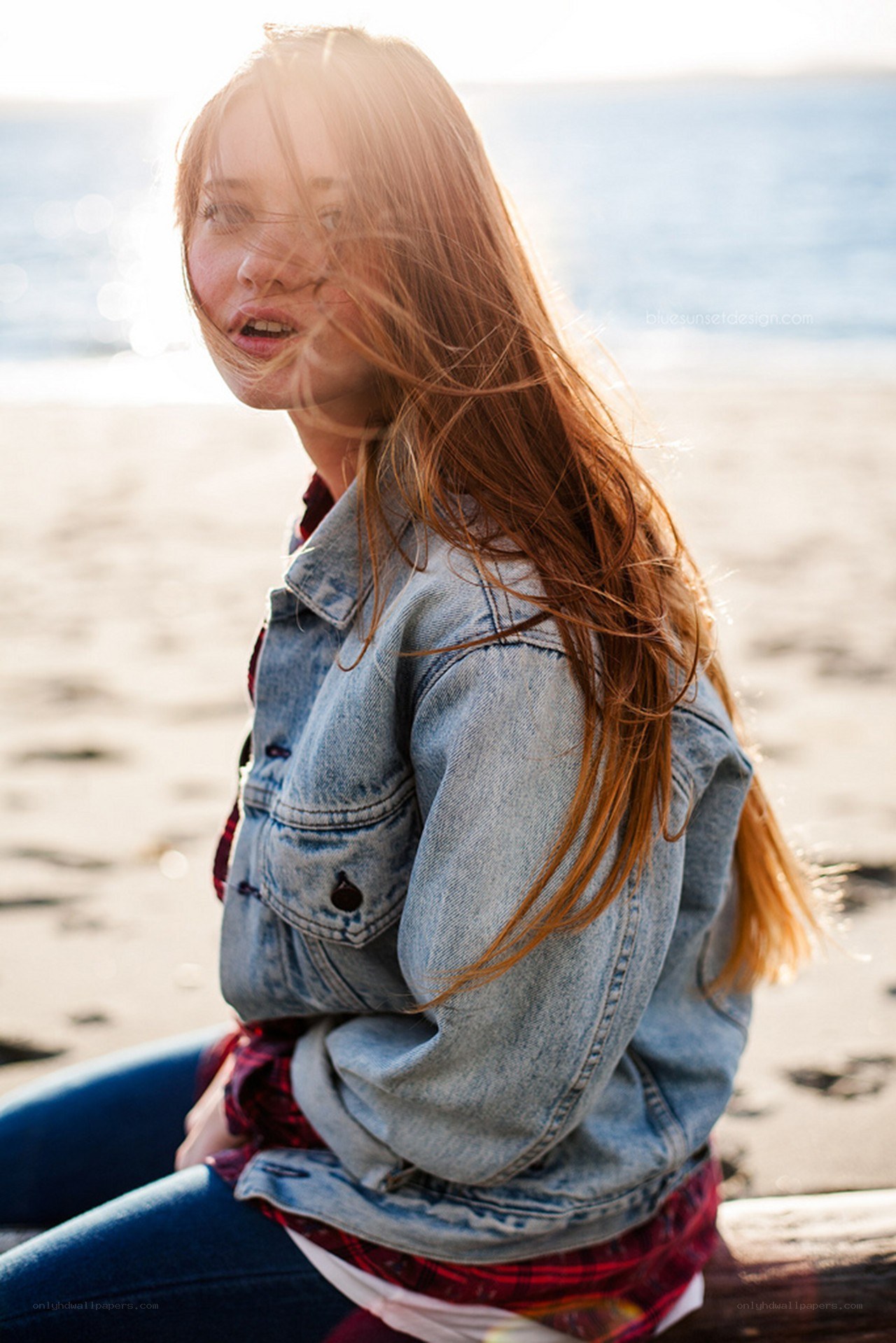 woman on beach with wind