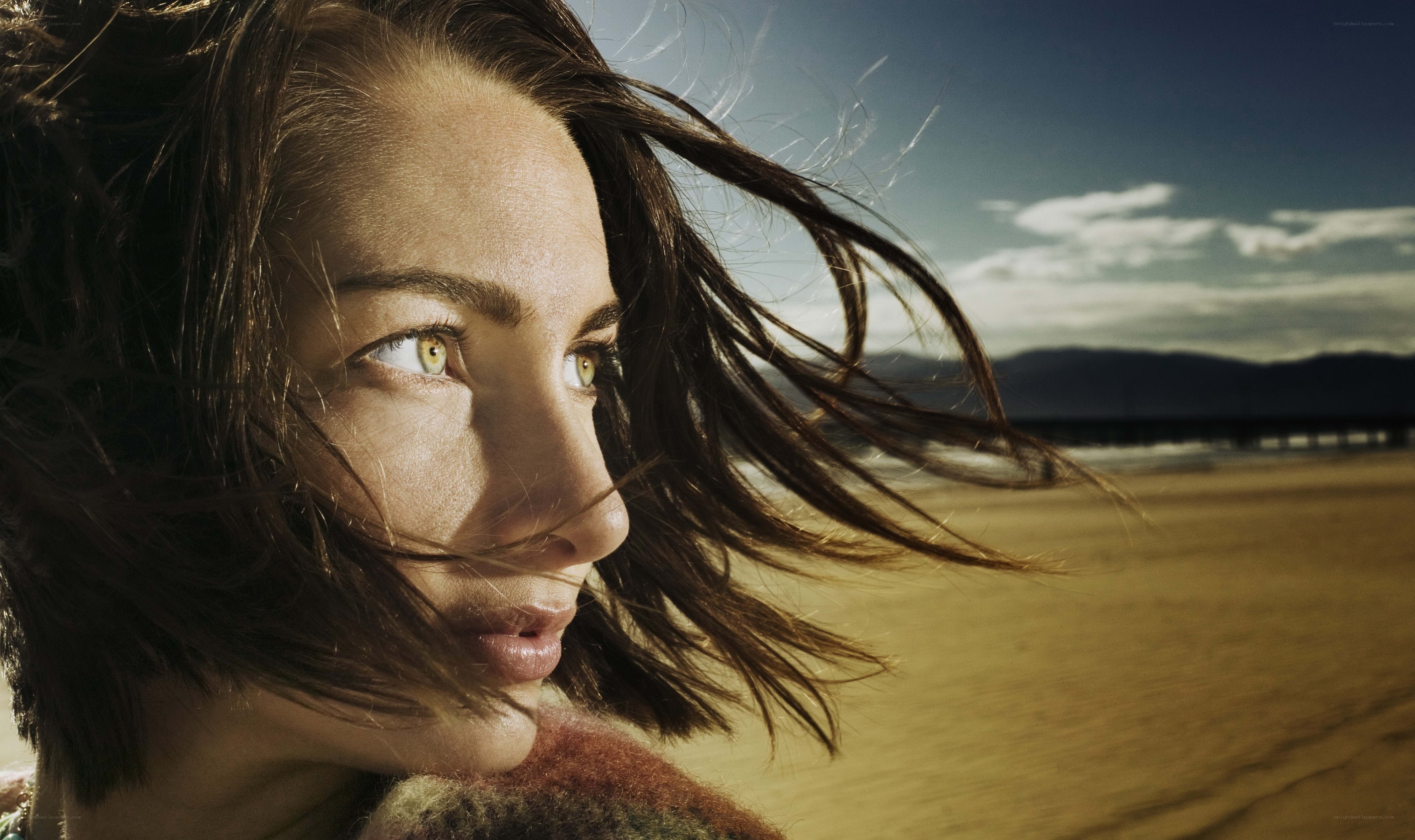 woman on beach with wind