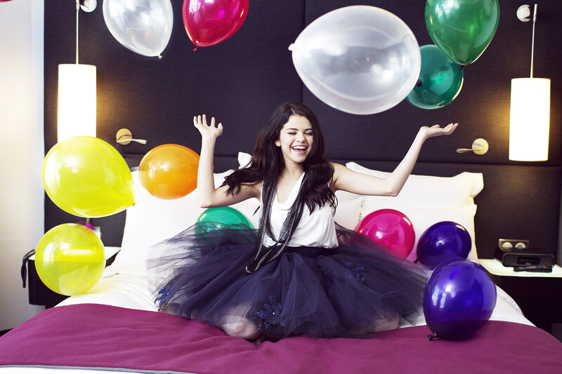 Woman on Bed with Balloons