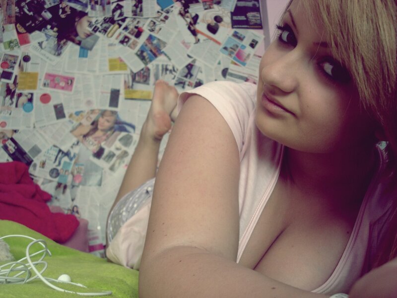 woman on bed with photos