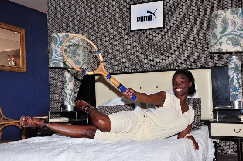 Woman on Bed with Racket