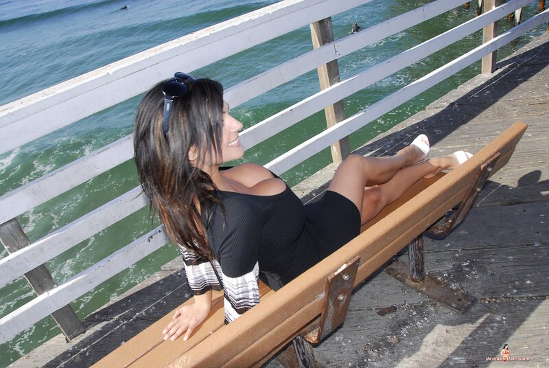 Woman on bench at pier