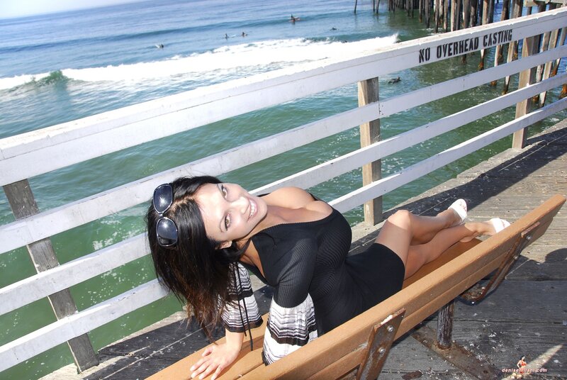 Woman on bench at pier