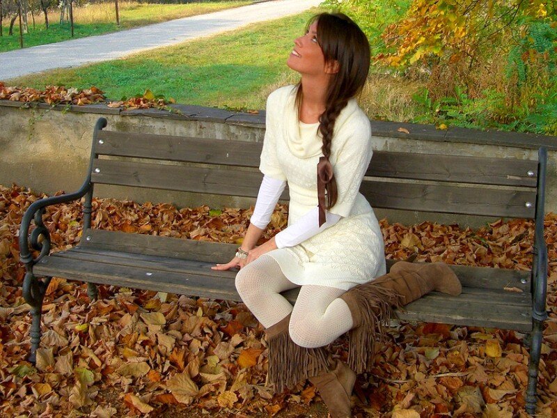 Woman on bench in autumn