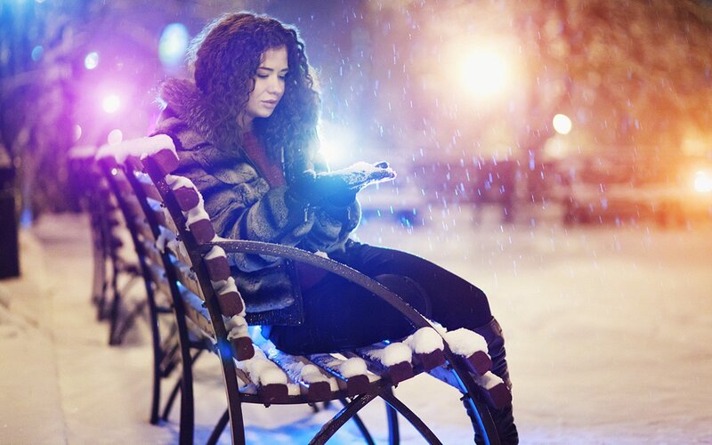 Woman on bench in snow