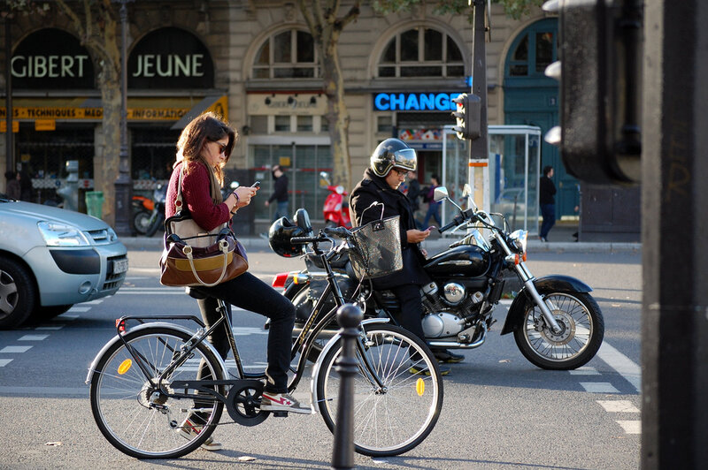 Woman on Bicycle at Crosswalk