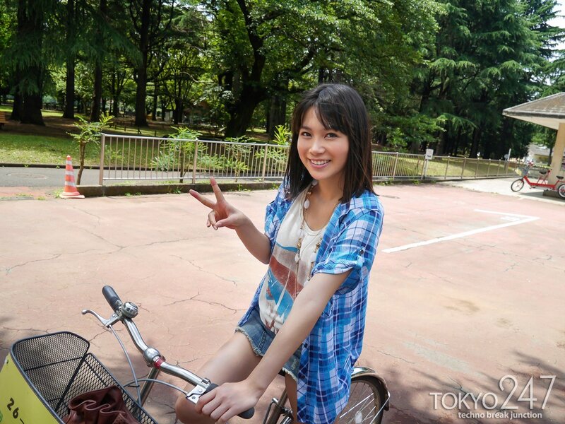 Woman on bicycle in park