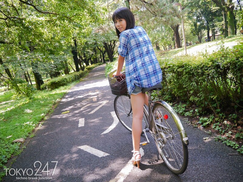 Woman on bicycle in park
