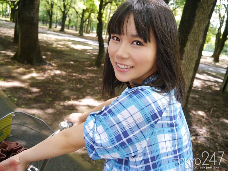 Woman on bicycle in park