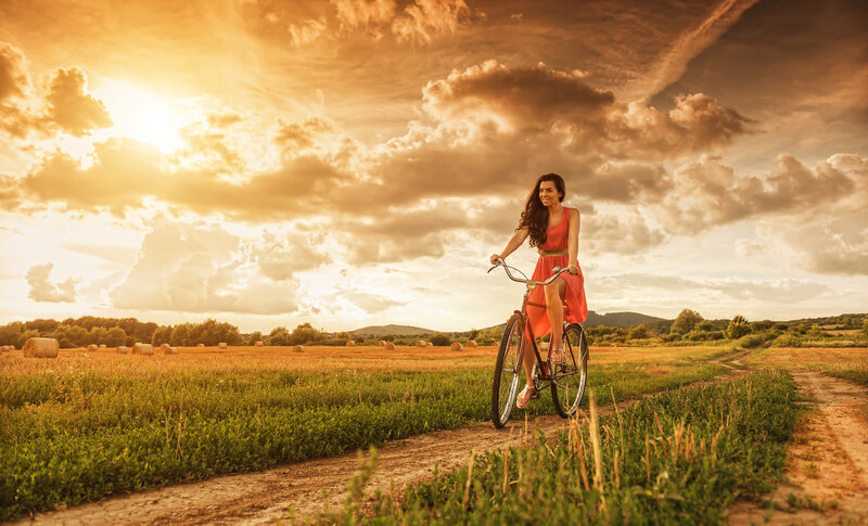 Woman on Bicycle — Orange